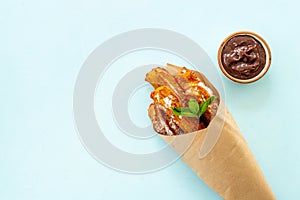 Fast food sweets - churros in paper bag