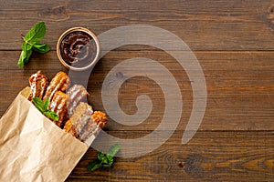 Fast food sweets - churros in paper bag