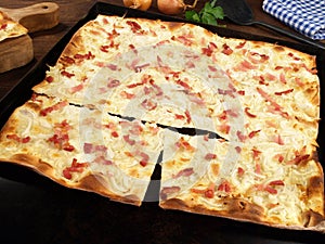 Fast Food - Traditional Tarte Flambee with Creme Fraiche, Onion and Bacon