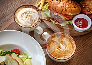 Fast food two cups of coffee and salad