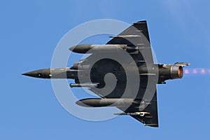 Fast green air force fighter jet flyby