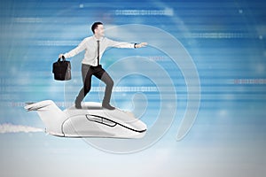 Fast Internet with Businessman flying with a computer mouse