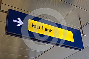 Fast Lane sign in blue and yellow at the airport