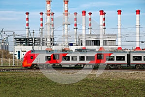 Fast modern metro train on the city background.