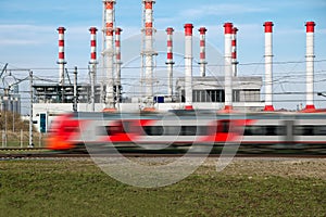 Fast modern metro train on the city background.