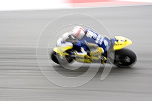 Fast motorcycle racer on track