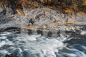 Fast mountain river in autumn season. Waterstream