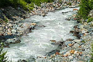 Fast mountain river Feevispa flows from Spielboden towards Saas-Fee village and Saas valley
