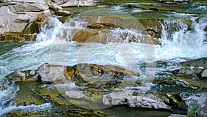 Fast mountain river flowig in cascade of waterfalls