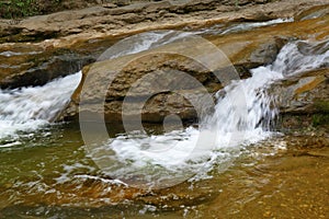 A fast mountain stream or a small mountain river