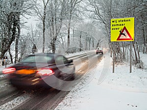 Fast moving car brakes in a snow storm