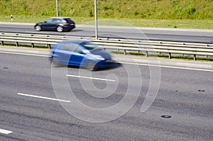 Fast moving car on a highway