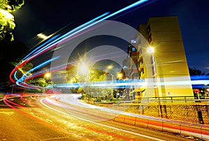 Fast moving car light on road