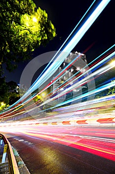 Fast moving car light on street