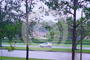 Fast moving car in the rain