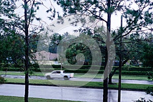 Fast moving car in the rain