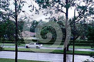 Fast moving car in the rain