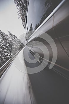 Fast moving car on a winter road