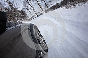 Fast moving car on a winter road