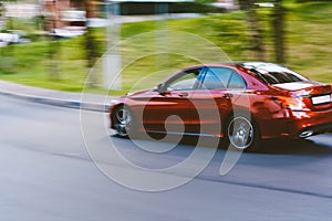 Fast moving red car with motion blur effect. overspeed concept