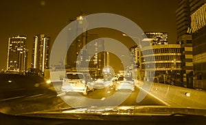 Fast moving traffic light trails at night in Bangkok