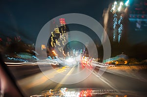 Fast moving traffic light trails at night in Bangkok, Blur