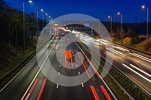 Fast moving traffic on the M42 passes through an active traffic management system during rush hour.