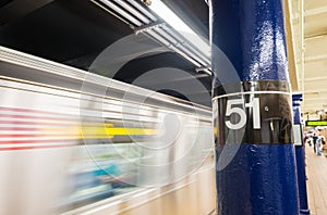 Fast moving train in New York subway. 51st street station