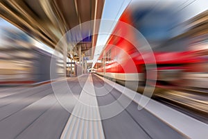 Fast moving train at station. Motion blur