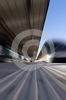 Fast moving train at station. Motion blur