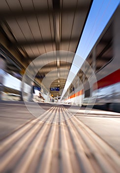 Fast moving train at station. Motion blur