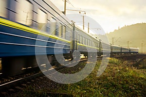 Fast moving train through viaduct in mountains