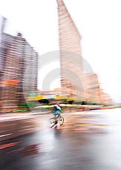 New York City Street Biker Blurred Out with Flatiron Building in the Background