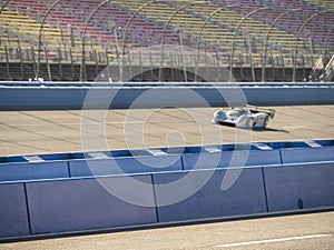 Fast Race Car Speeding Down Track