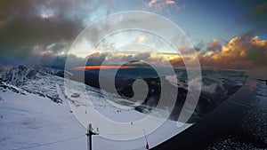 Fast running clouds over Low Tatras with magic sunset. Chopok mountain 2024 meters