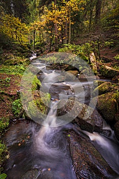 Fast running river waterfall over small rocks