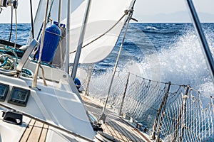 Fast sailing cruising yacht at heeling