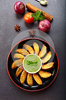 Fast snack foods- spicy  potato wedges- vegan diet.