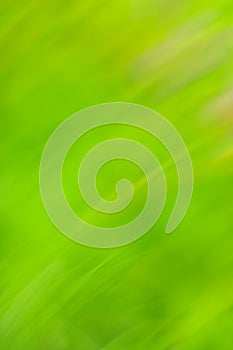 Fast speedy motion blur green background. High speed motion blurred green background