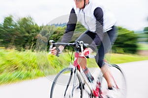 Fast Sport Bicyclist on bike with motion blur