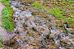 A fast stream running among the stones.