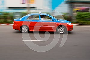 Fast taxi in city traffic