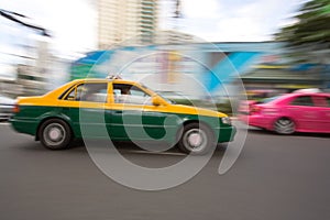 Fast taxi in city traffic