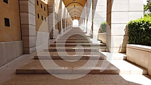 Fast walking under the arcades on long archway corridor hyperlapse in San Giovanni Rotondo - Apulia - Italy