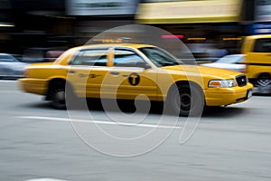 Fast yellow taxi in New York photo