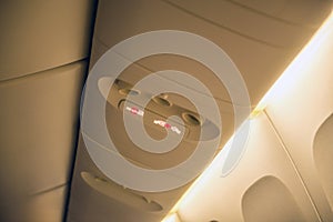 Fasten seat belt sign on a plane and no smoking sign on airplane