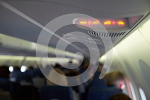 Fasten seat belts and no smoking signs in plane