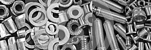 Fasteners collage. Horizontal long banner with different kinds of screws, rivet nuts. Black and white metal details