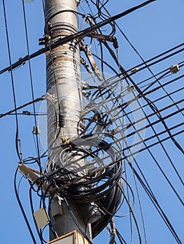 Fastening cables to a concrete pillar in disarray photo