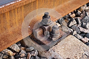 Fastening a rail to a railroad tie closeup